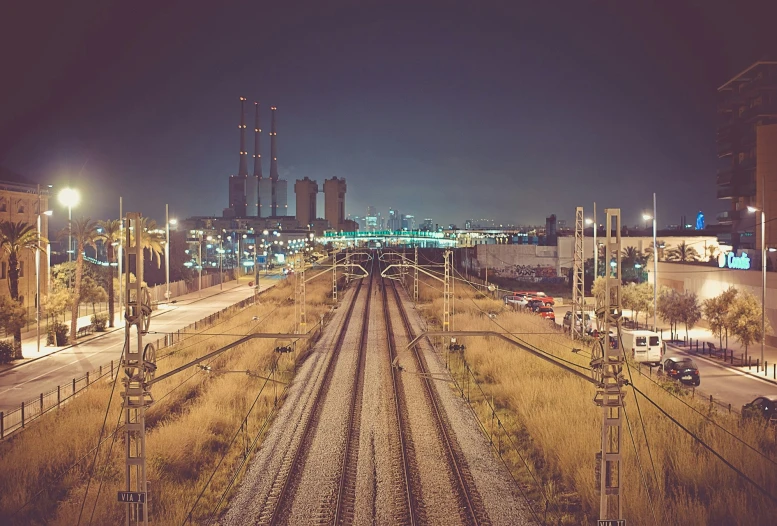 train tracks in the distance with some city buildings