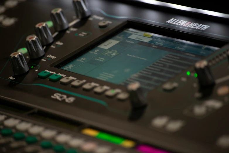 a closeup of a sound console with s and controls