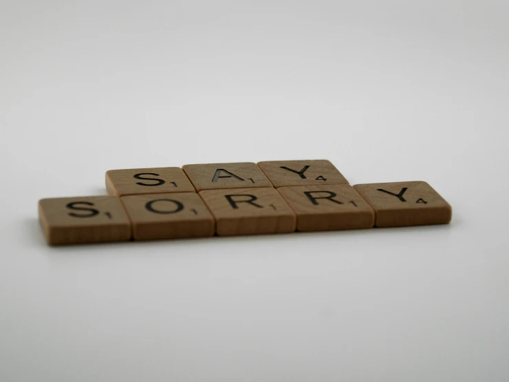 some sort of letter tiles with the word sorry printed on it