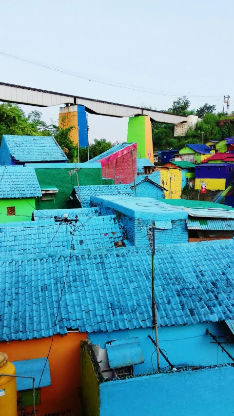 a blue roofs with bright colored roof tiles