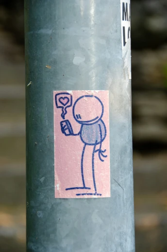 a sticker shows a man holding up a cell phone