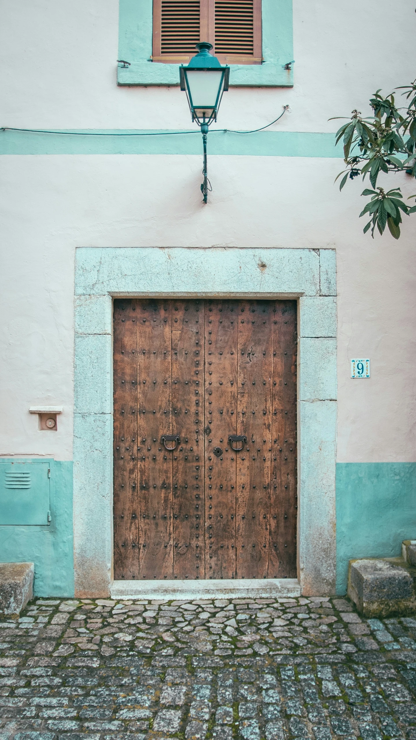 large door on side of a blue building