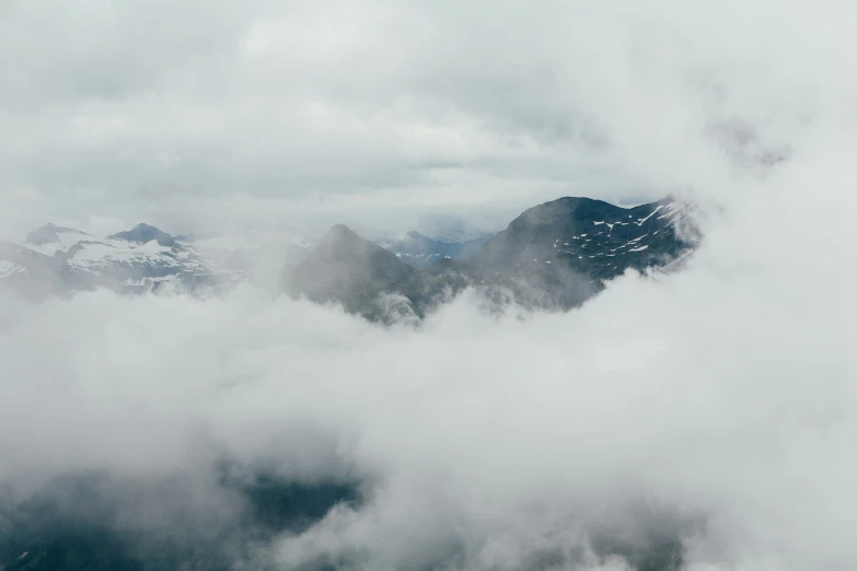 a po of mountains above the clouds from a plane