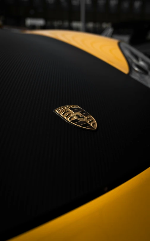 a bugatti badge that is on the side of a car