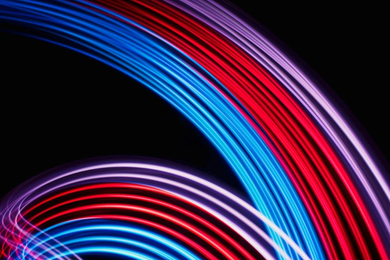 colorful lights are in the shape of wavy lines