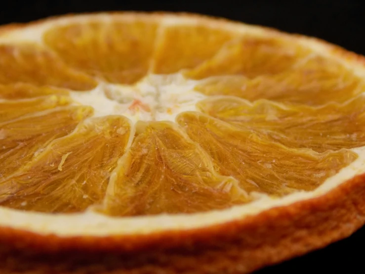 a close - up po shows the oranges top part