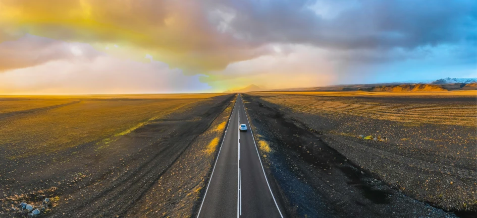 trucks move along a large open dirt road