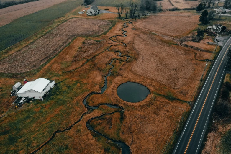 a small rural farm near a highway