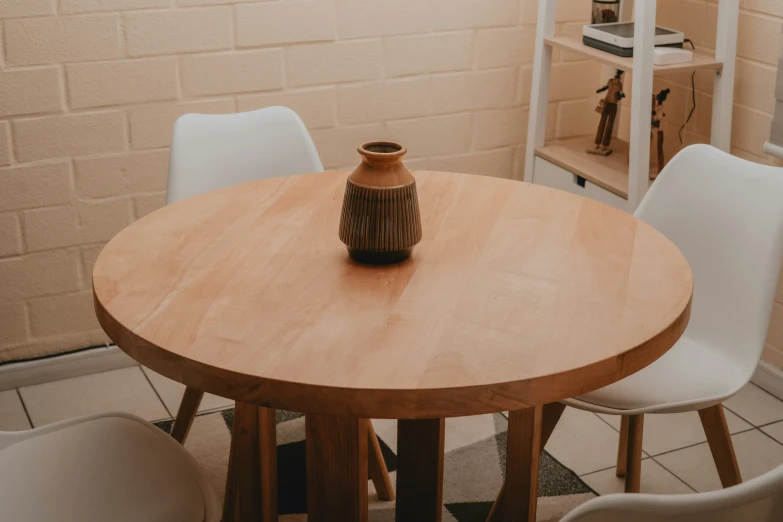 there is a vase sitting on top of a table