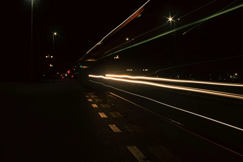 there is an image of a car going down the highway at night