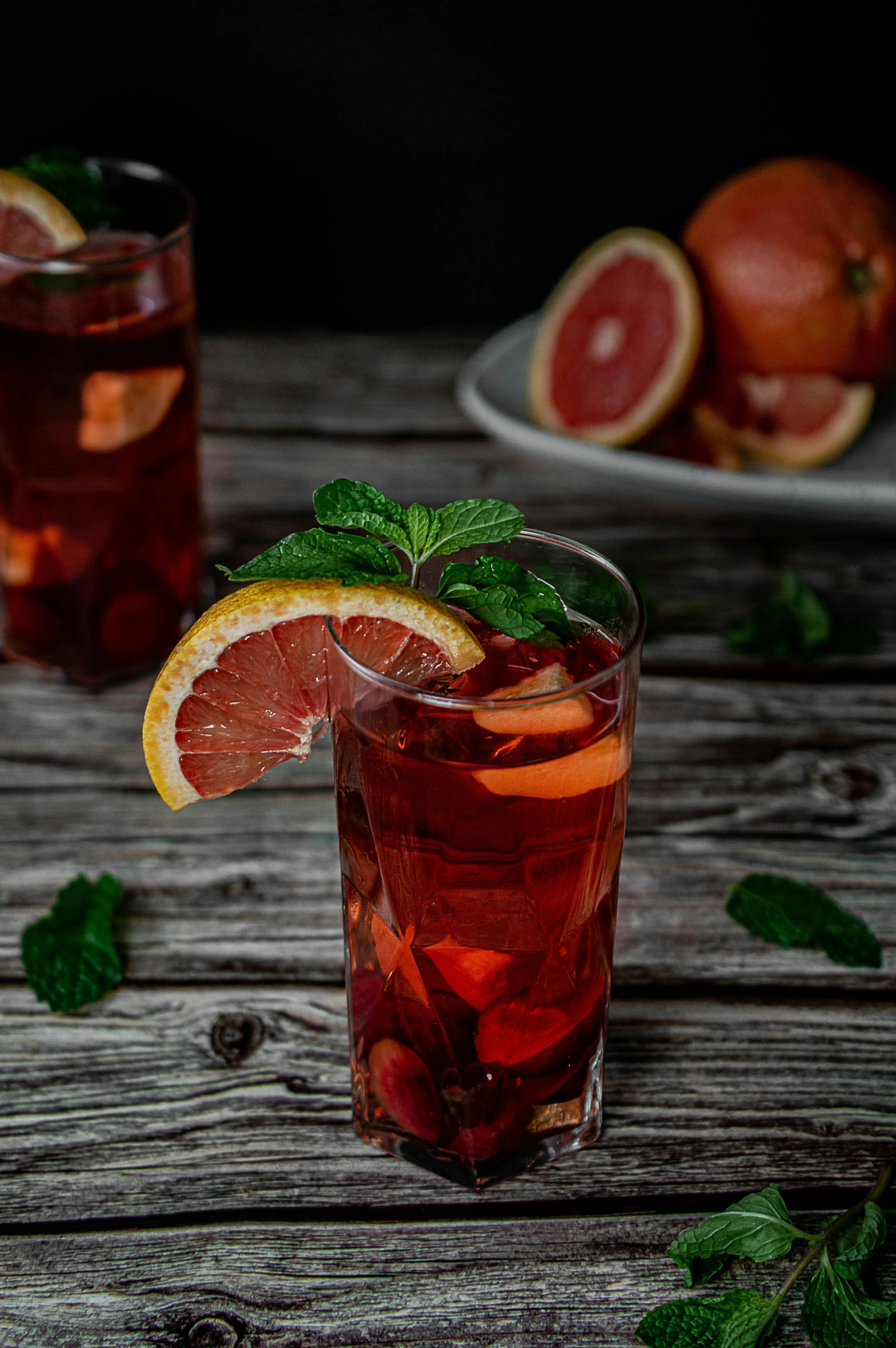 gfruit and lemon drink with mint leaves in glasses