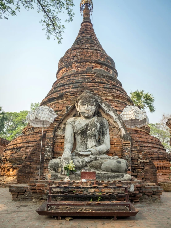 there is a buddha statue in the middle of this temple