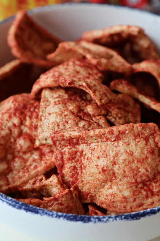 a close up of a bowl of food containing chips