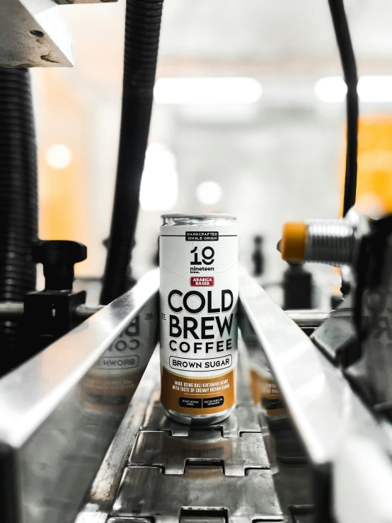 cans of craft beer on top of a conveyor belt