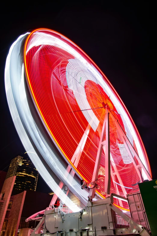 a ferris wheel with red and white lights