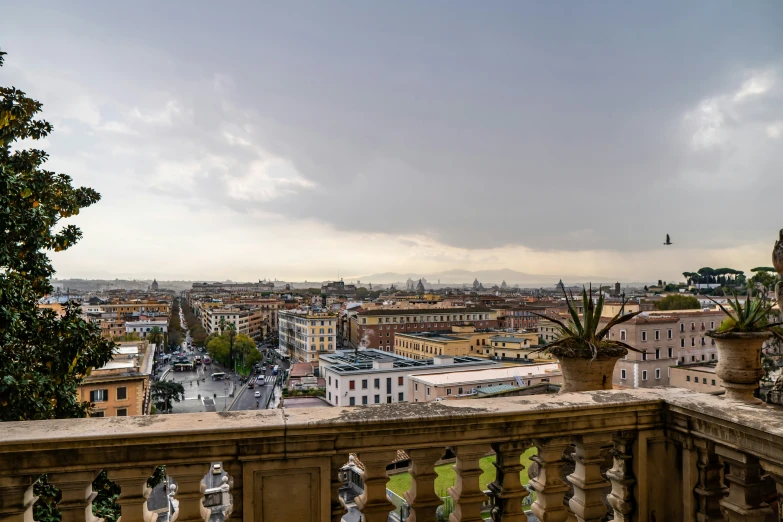 a view of a city with trees, buildings and plants