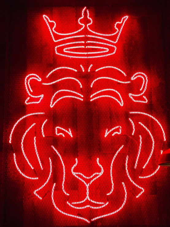 a close up of a traffic light with a lion's head