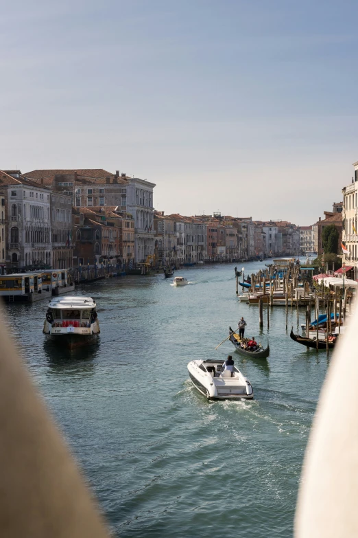 two boats in the river next to buildings