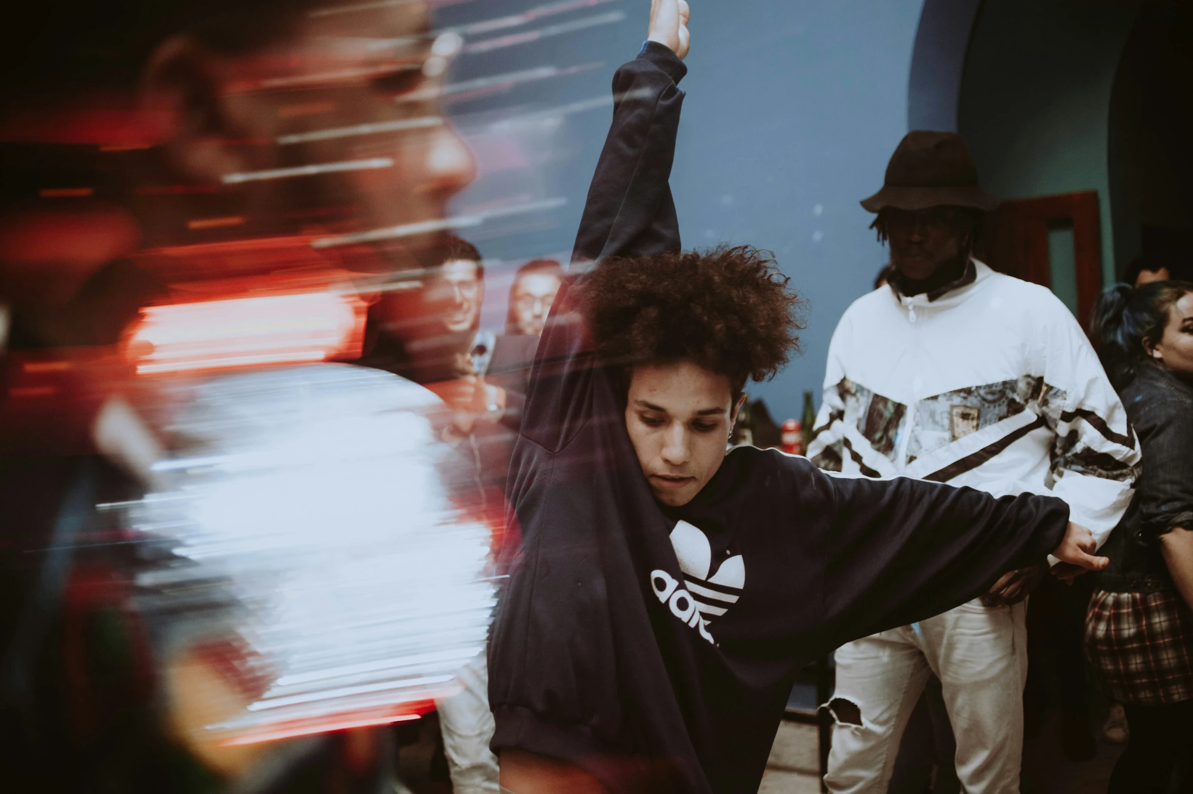 a man doing tricks on his skateboard at a public event