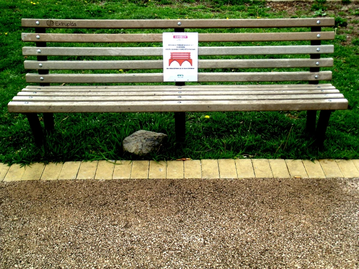 a bench with a sign that reads, don't feed the animals