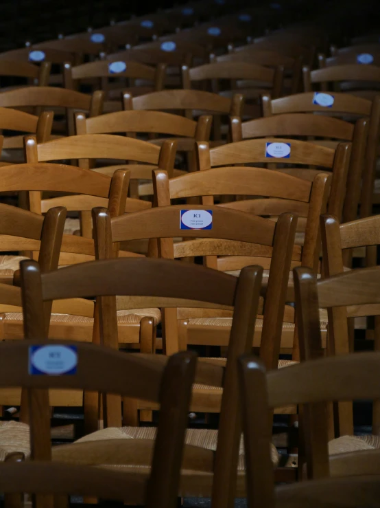 rows of chairs in empty with signs on them