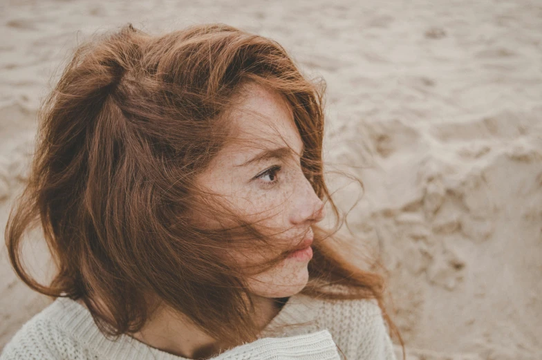 an image of a girl with brown hair on beach