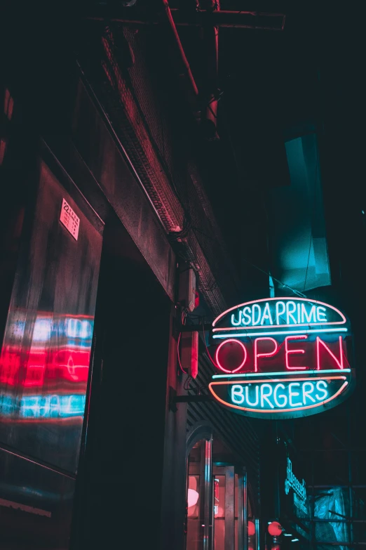 a neon sign that reads utopia primes open burgers