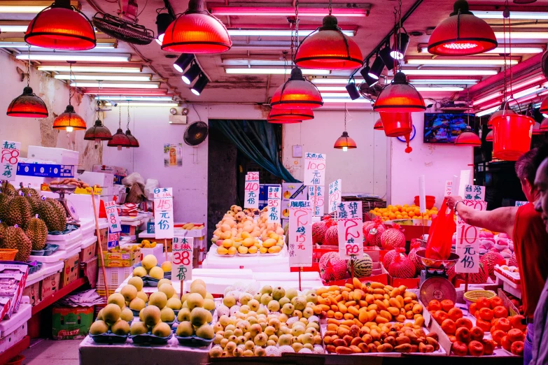 a produce section of a store with various fresh fruits