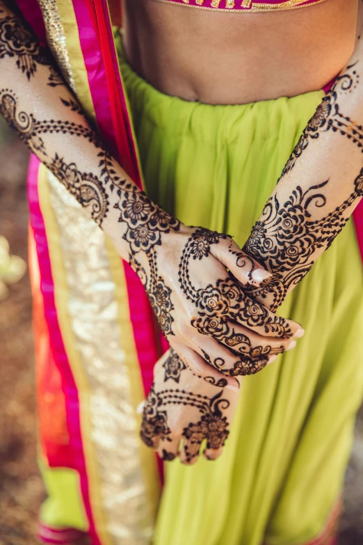 a woman's hand with henna on it