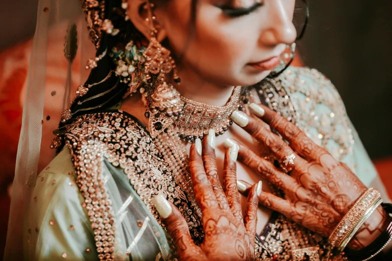 a woman with jewelry on her hands
