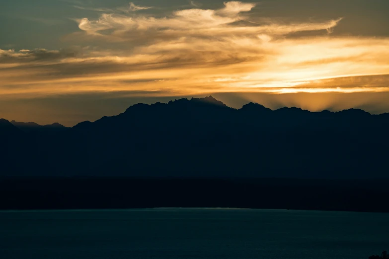 a beautiful sky shows over a body of water