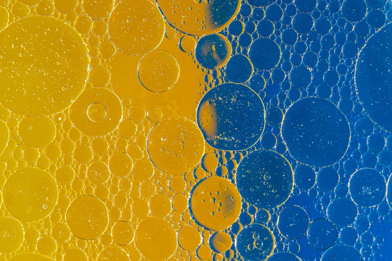 a very bright yellow and blue background with small drops