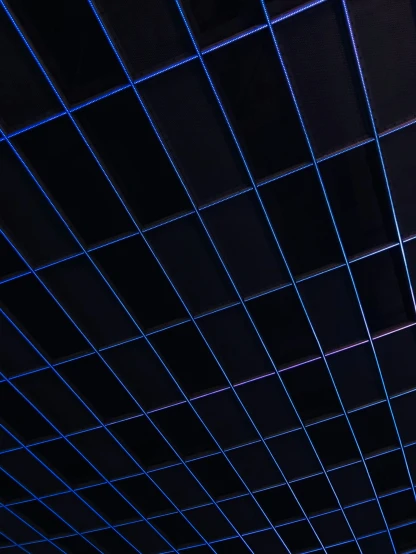 ceiling covering lit up at night by blue lights