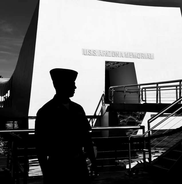 a black and white po of a person standing near an airport