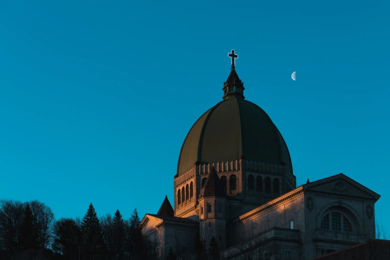 the moon and a very large church tower