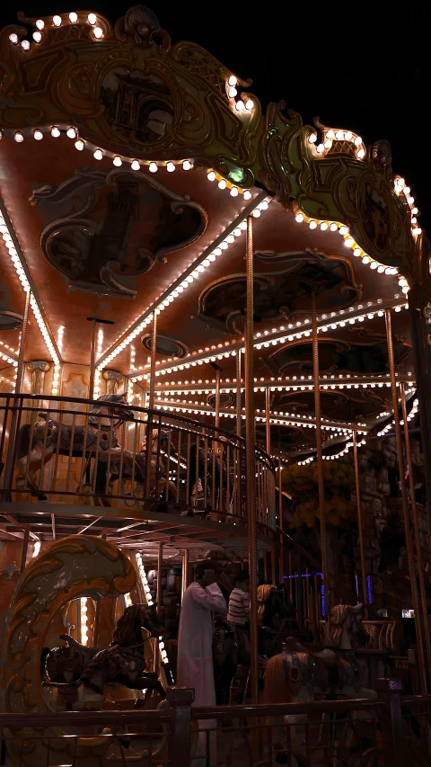a carousel with many lights shining
