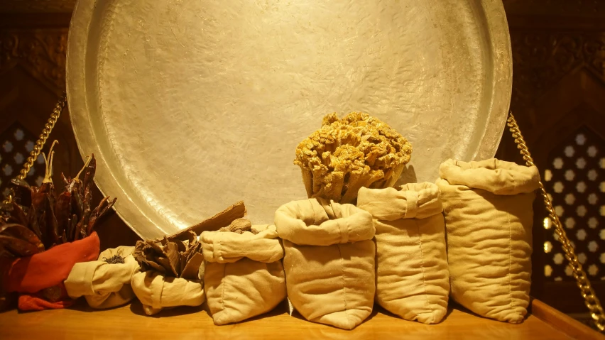 a variety of cookies with white frosting near a decorative gold rim