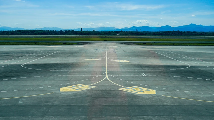 the landing strip of an airport with no passengers on it