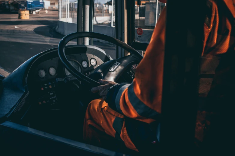 a person standing at the wheel of a truck