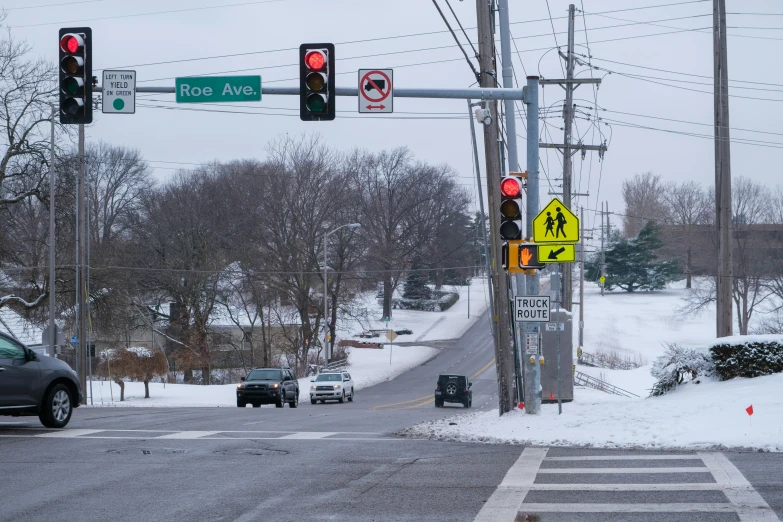 a street with traffic lights, stoplights and signs