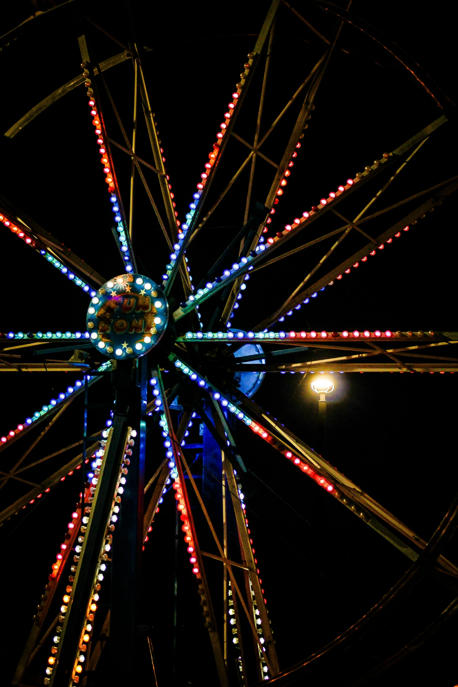 a ferris wheel with lights and decorations on it