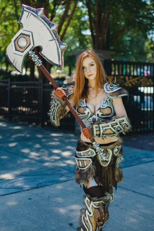 a woman with a hammer and an axe on a street