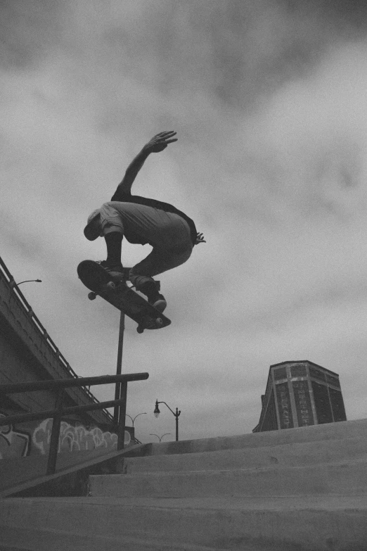 a skateboarder is doing a trick off a rail