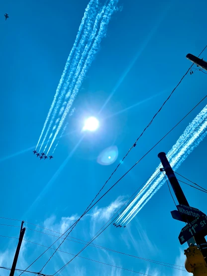 planes flying in the air and leaving trails