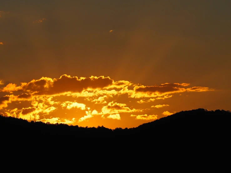 the sky is shown in this image with orange clouds