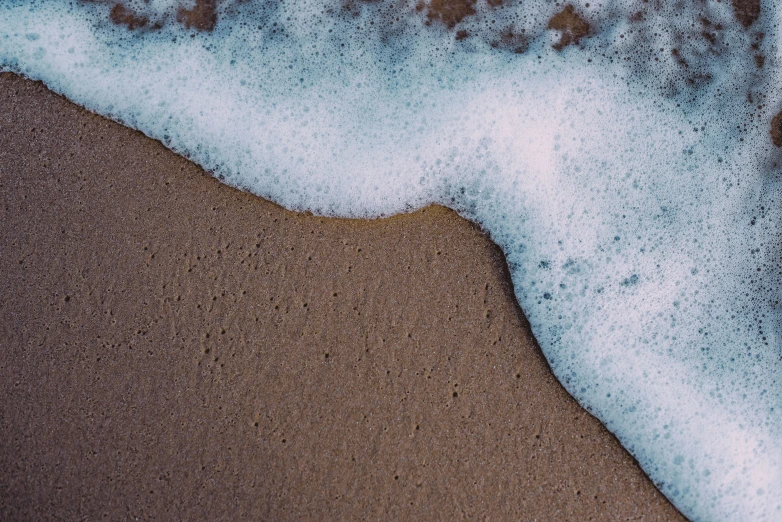 the white foam on top of some water