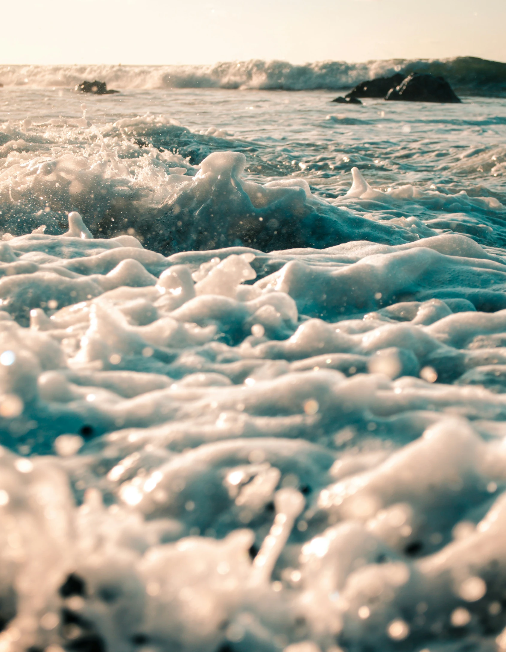 some ice water and some rocks in the ocean