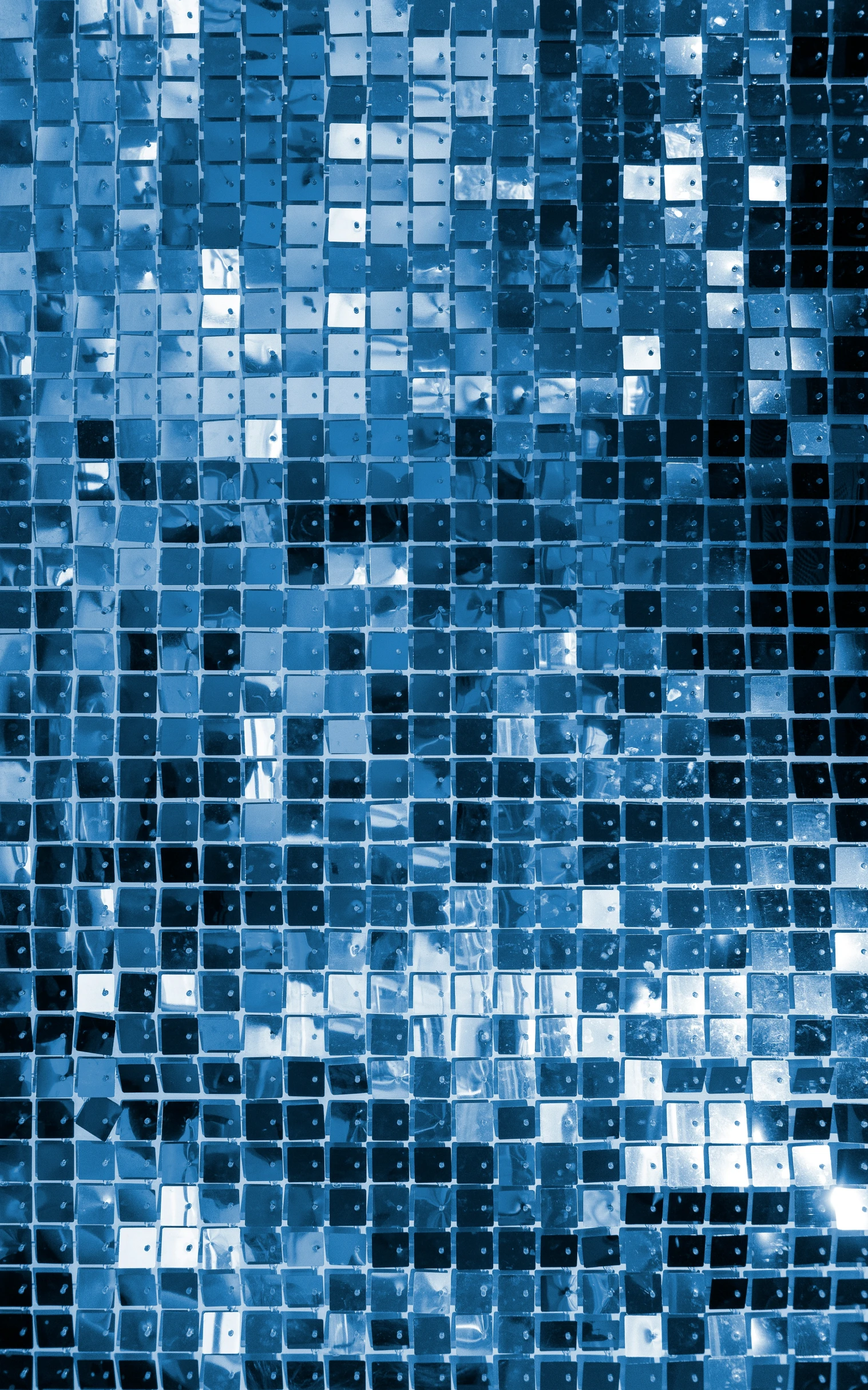 a closeup image of blue colored cubes on the wall