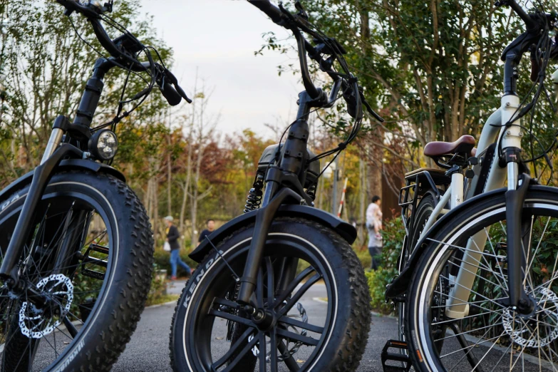 several different sized bikes are parked near each other