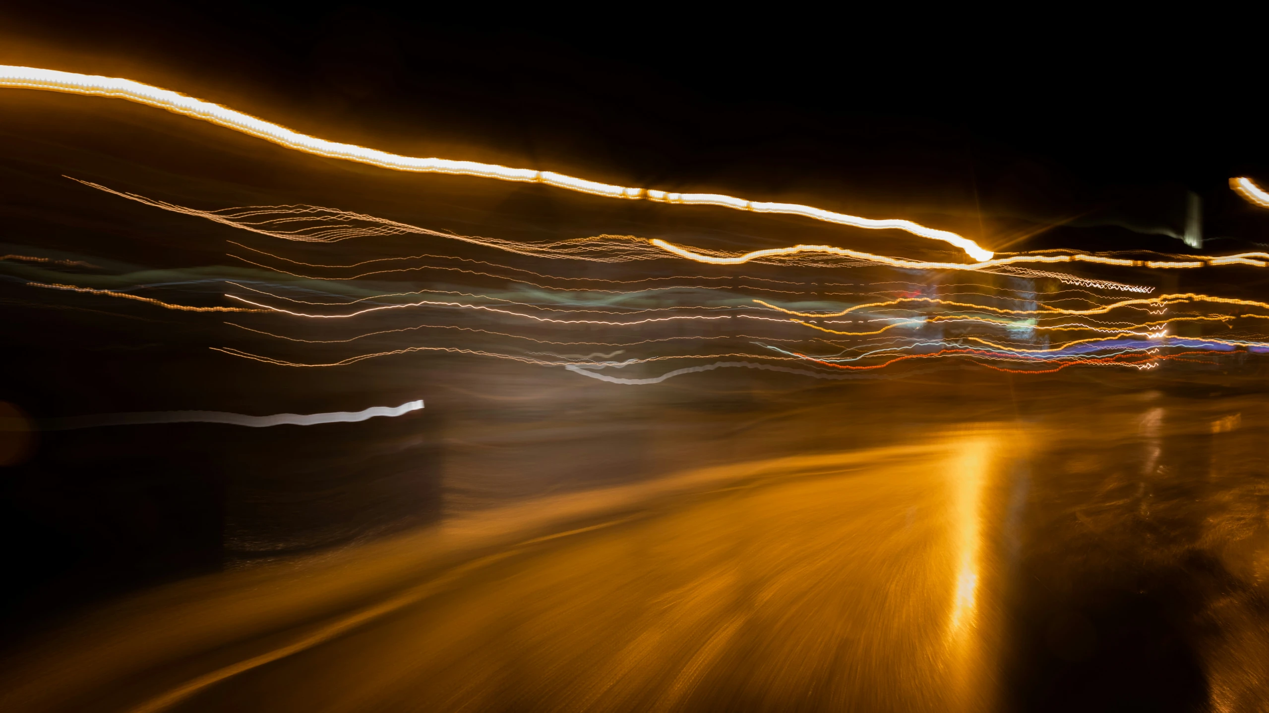 long exposure view of blurry street lights at night